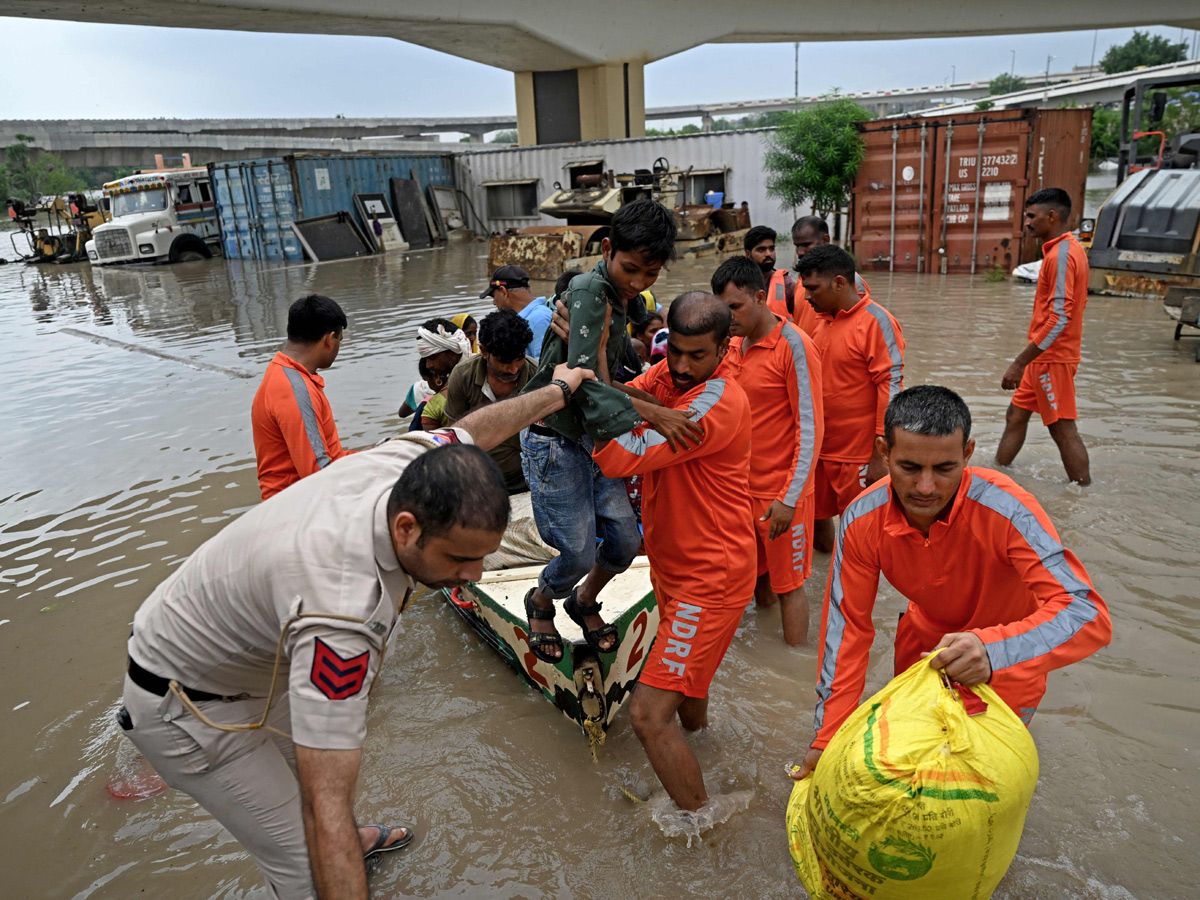 Yamuna Breaches Danger Level Waterlogging in Parts of Delhi Photos - Sakshi13