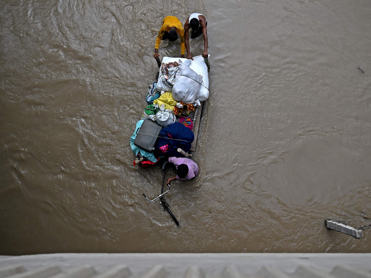 Yamuna Breaches Danger Level Waterlogging in Parts of Delhi Photos - Sakshi14