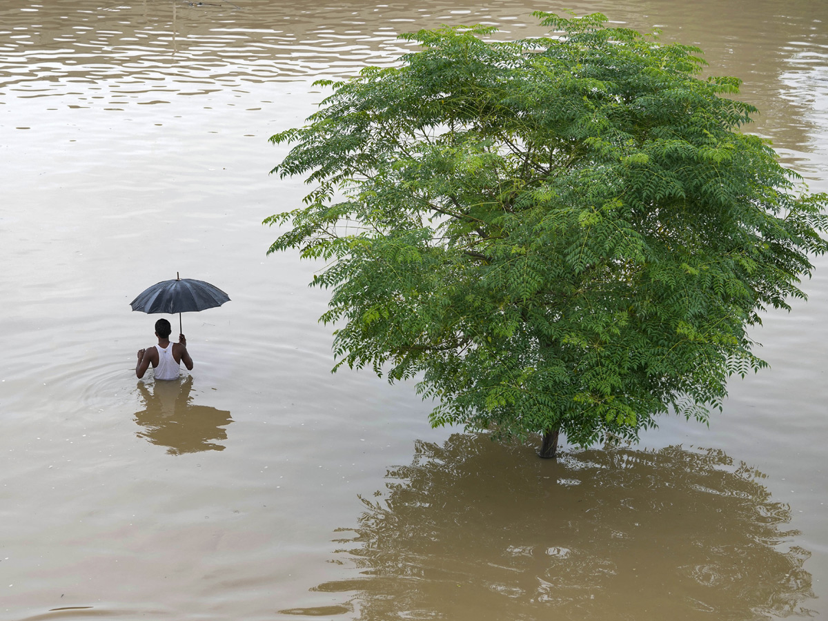 Yamuna Breaches Danger Level Waterlogging in Parts of Delhi Photos - Sakshi16