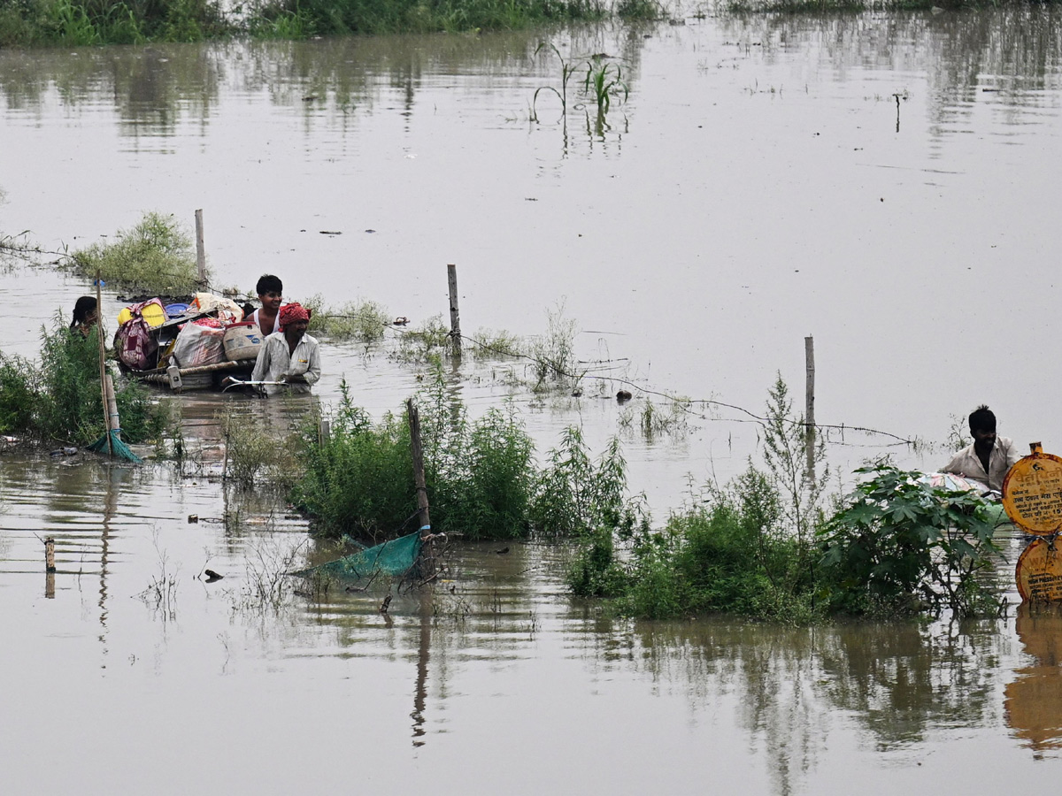 Yamuna Breaches Danger Level Waterlogging in Parts of Delhi Photos - Sakshi20