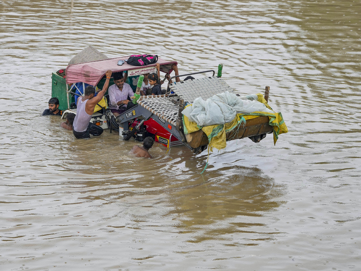 Yamuna Breaches Danger Level Waterlogging in Parts of Delhi Photos - Sakshi32