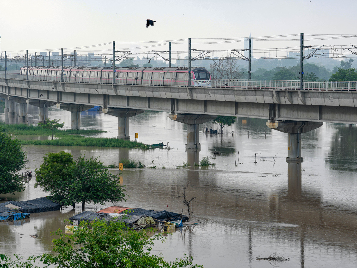 Yamuna Breaches Danger Level Waterlogging in Parts of Delhi Photos - Sakshi35