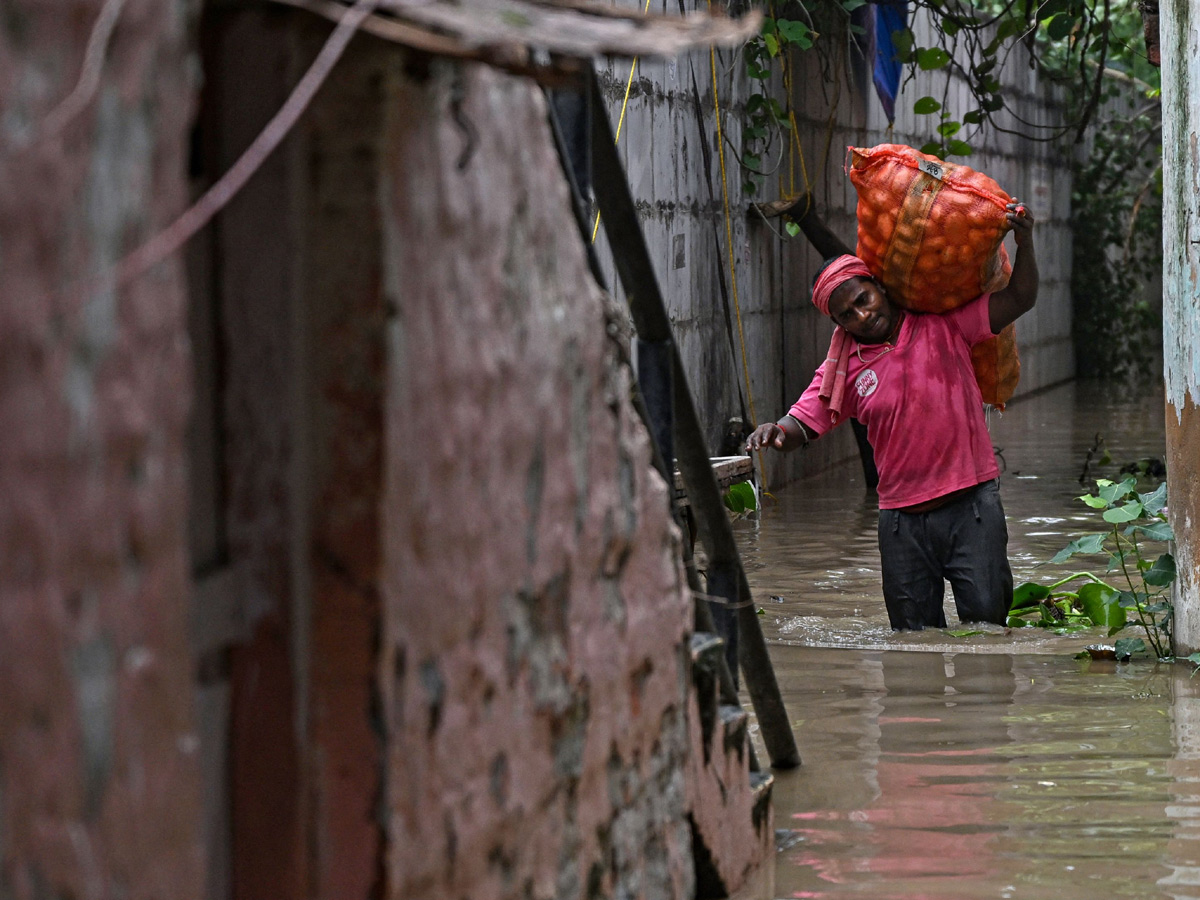 Yamuna Breaches Danger Level Waterlogging in Parts of Delhi Photos - Sakshi47