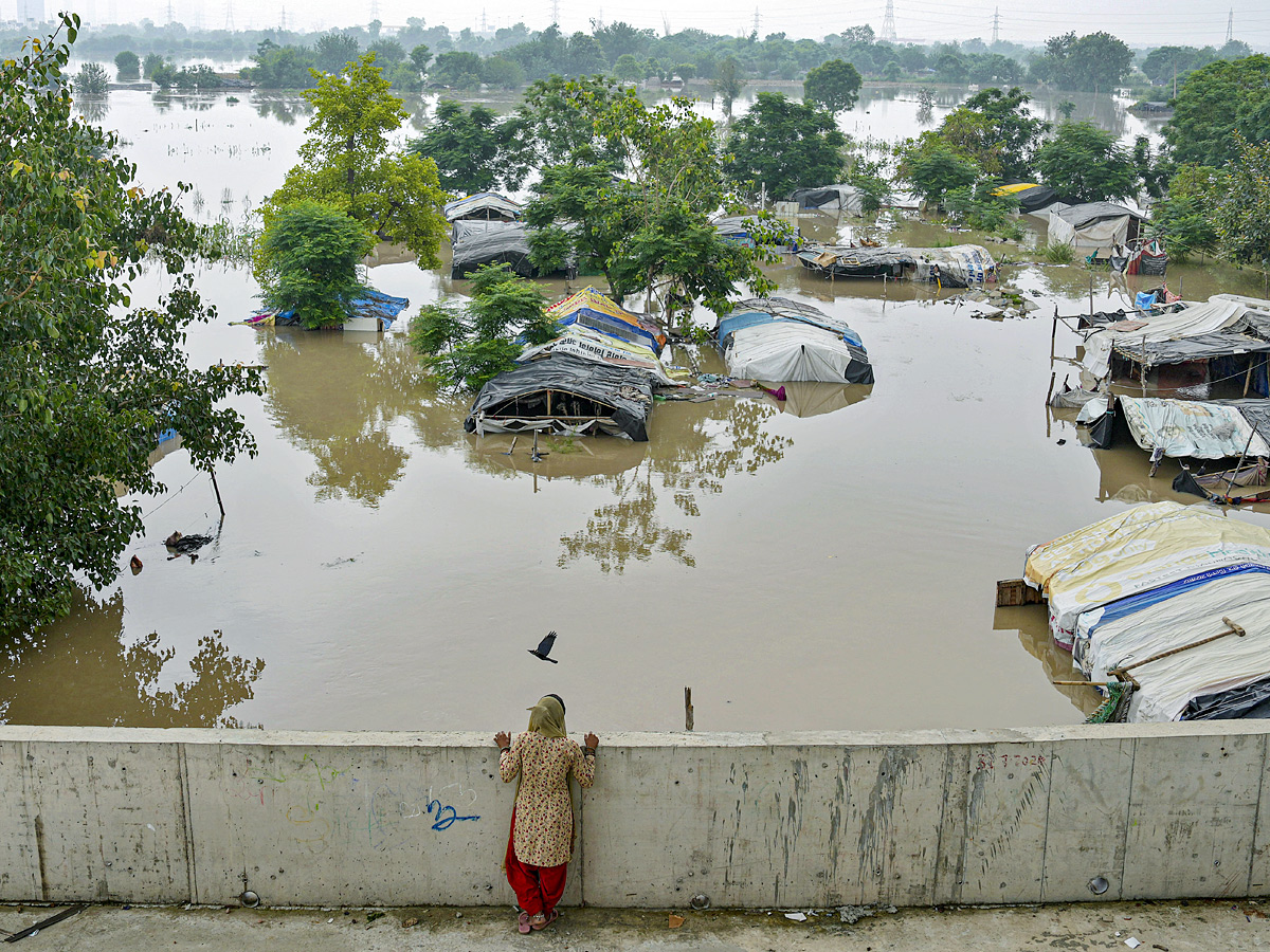 Yamuna Breaches Danger Level Waterlogging in Parts of Delhi Photos - Sakshi8