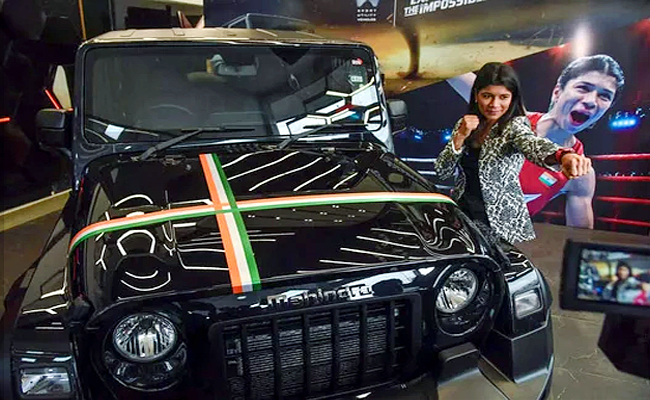 Mahindra gifts Thar to Nikhat Zareen for winning boxing championship Photos - Sakshi2