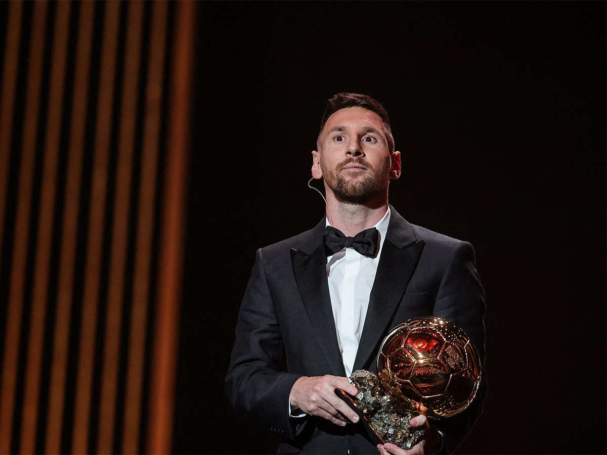 Lionel Messi poses prior to the 2023 Ballon dOr France Football award ceremony - Sakshi2