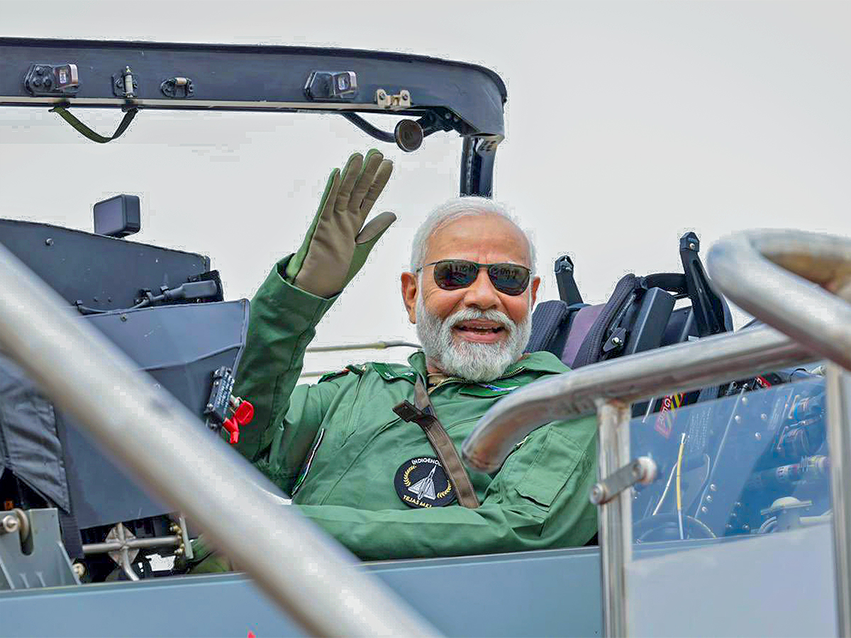 Narendra Modi during taking a sortie on the Tejas in Bengaluru - Sakshi2