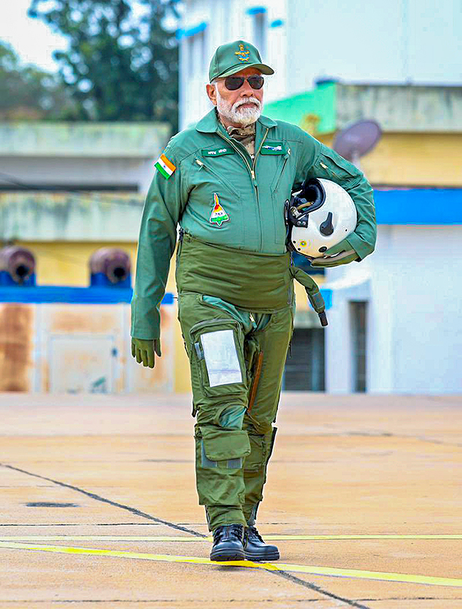 Narendra Modi during taking a sortie on the Tejas in Bengaluru - Sakshi3