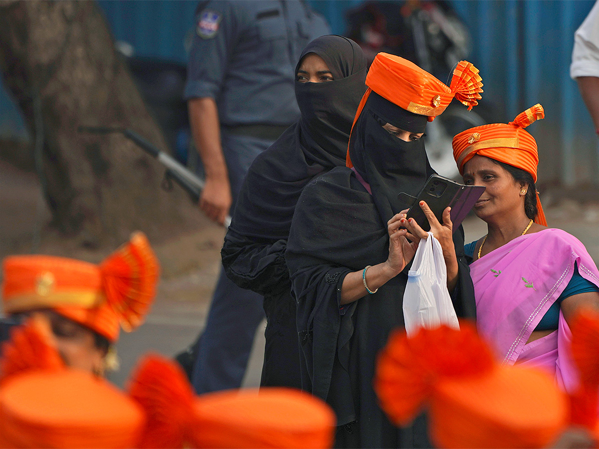 Narendra Modi greets supporters as he arrives for an election campaign rally - Sakshi17