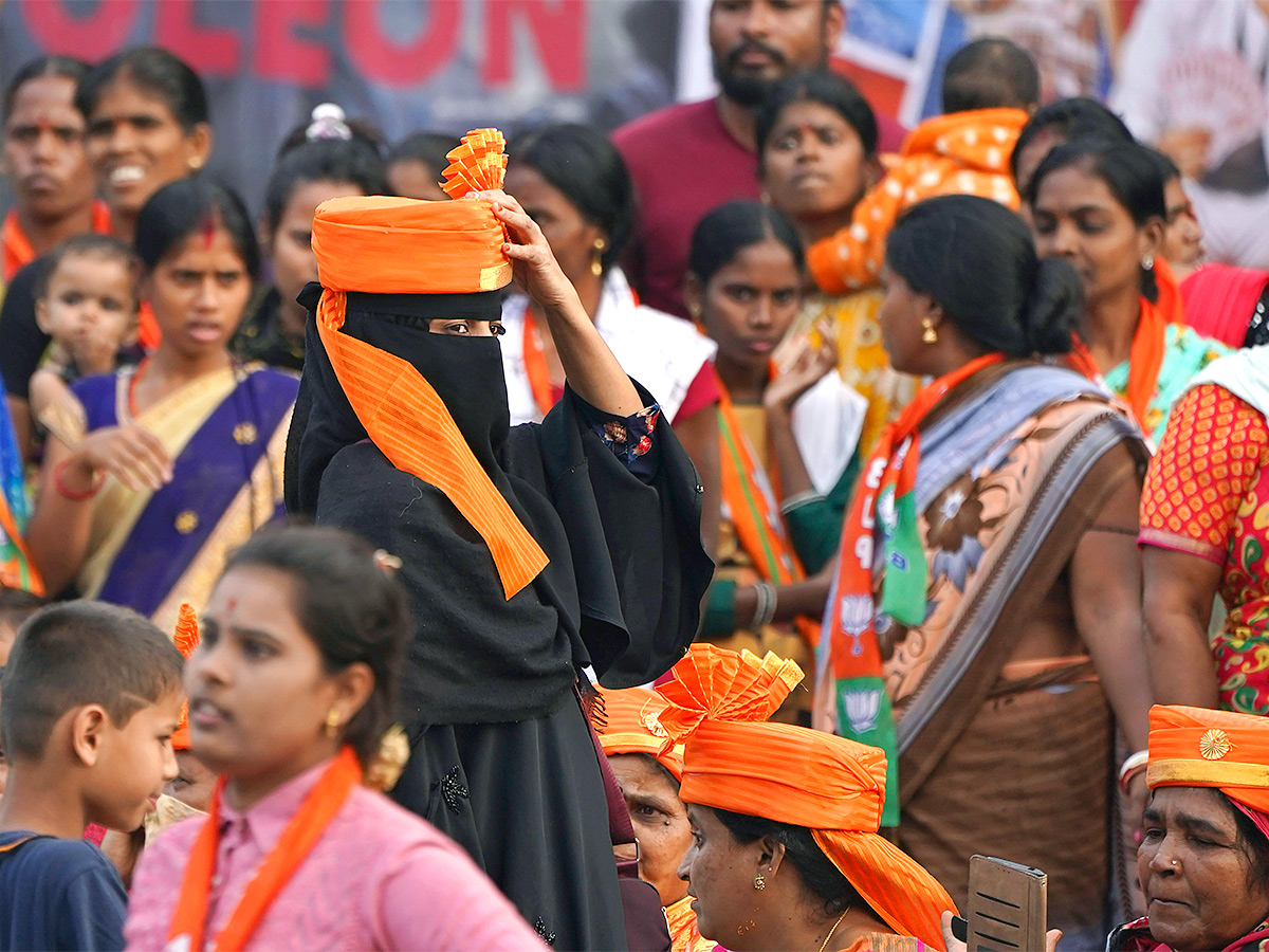 Narendra Modi greets supporters as he arrives for an election campaign rally - Sakshi18