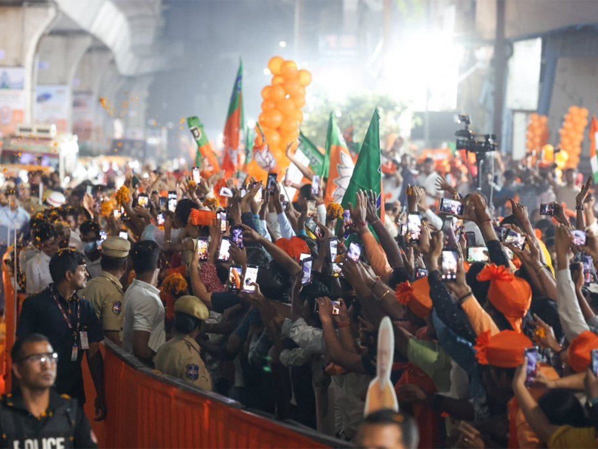 Narendra Modi greets supporters as he arrives for an election campaign rally - Sakshi8