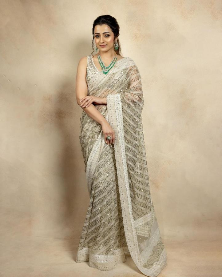 Trisha Krishnan Look Absolutely Stunning In Half White Saree - Sakshi3