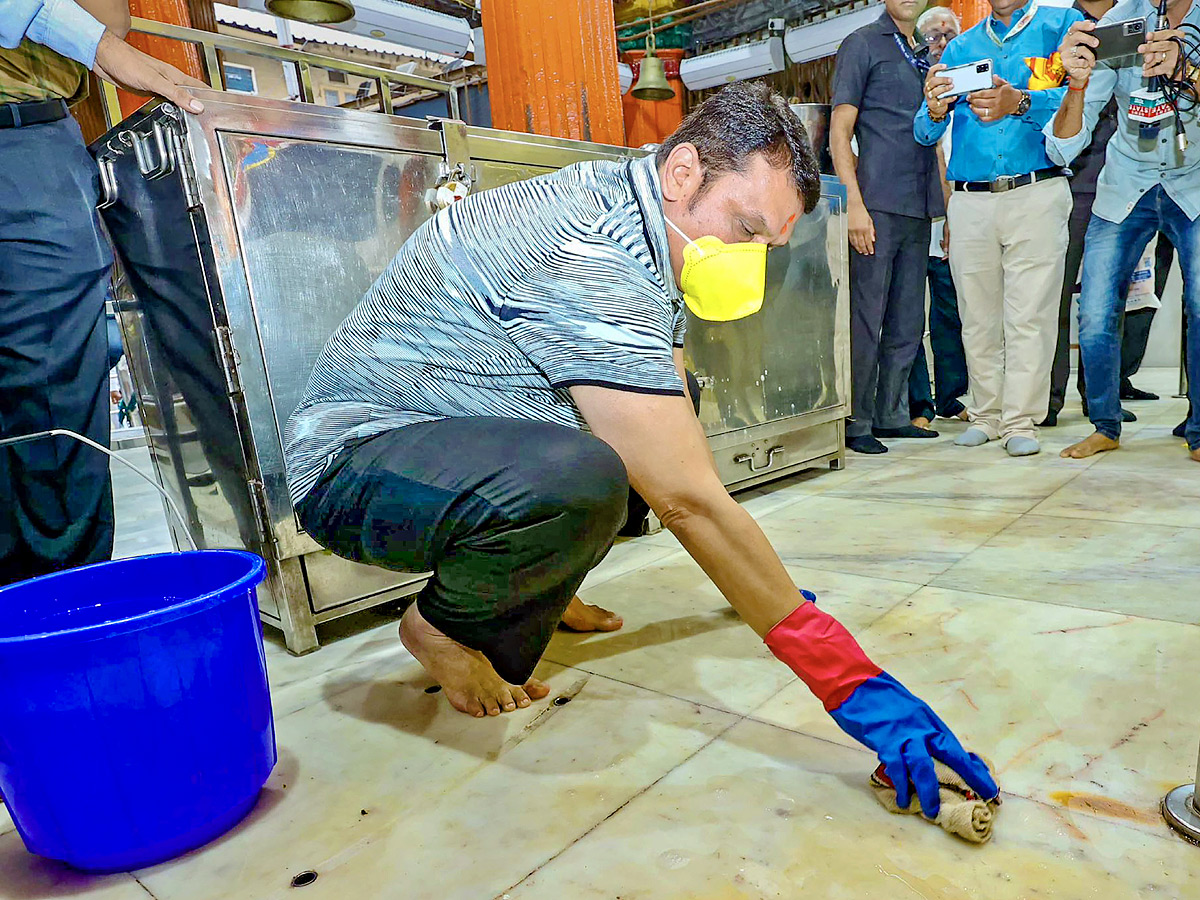 Officials take part in temple cleaning drive across the country Photos - Sakshi12