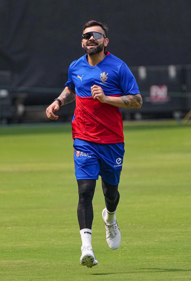 Virat Kohli during a training session ahead of the Indian Premier League - Sakshi14