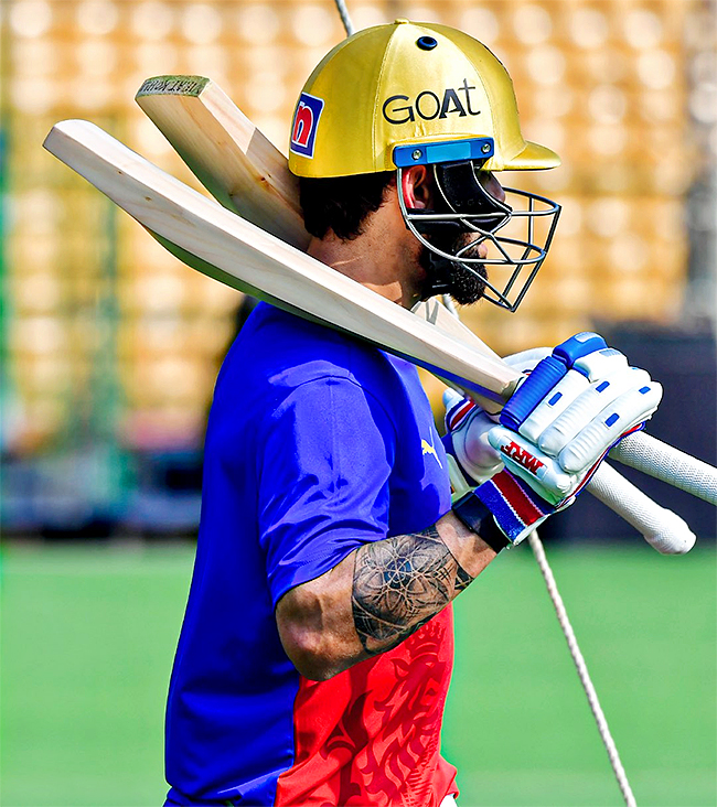 Virat Kohli during a training session ahead of the Indian Premier League - Sakshi4