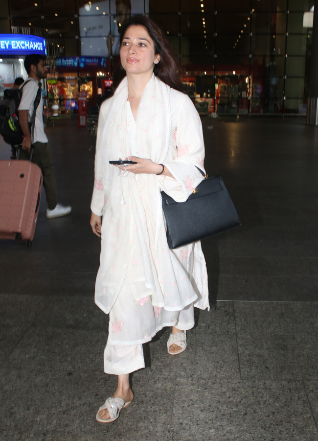 Tamannaah Bhatia Spotted At Mumbai Airport Arrival Photos - Sakshi3