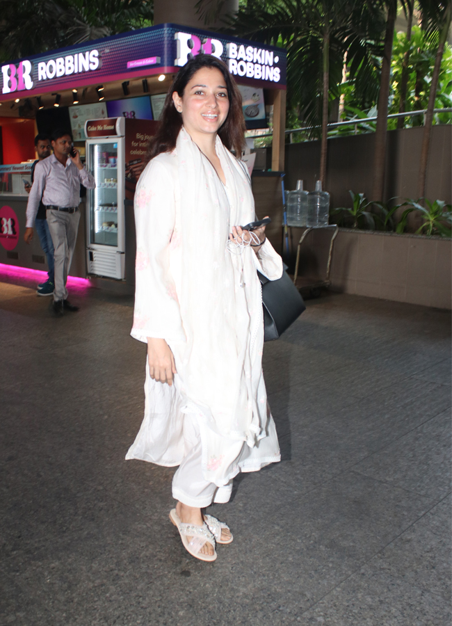 Tamannaah Bhatia Spotted At Mumbai Airport Arrival Photos - Sakshi7