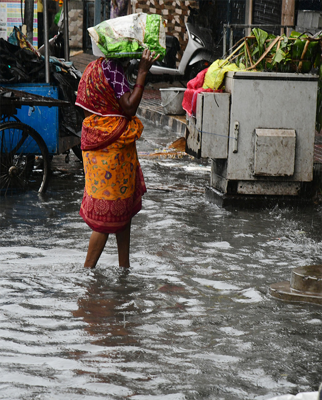 heavy rain in visakhapatnam photos24