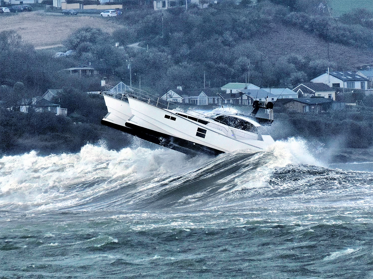 Twin hull hydrofoiling catamaran smashes big wave storm2