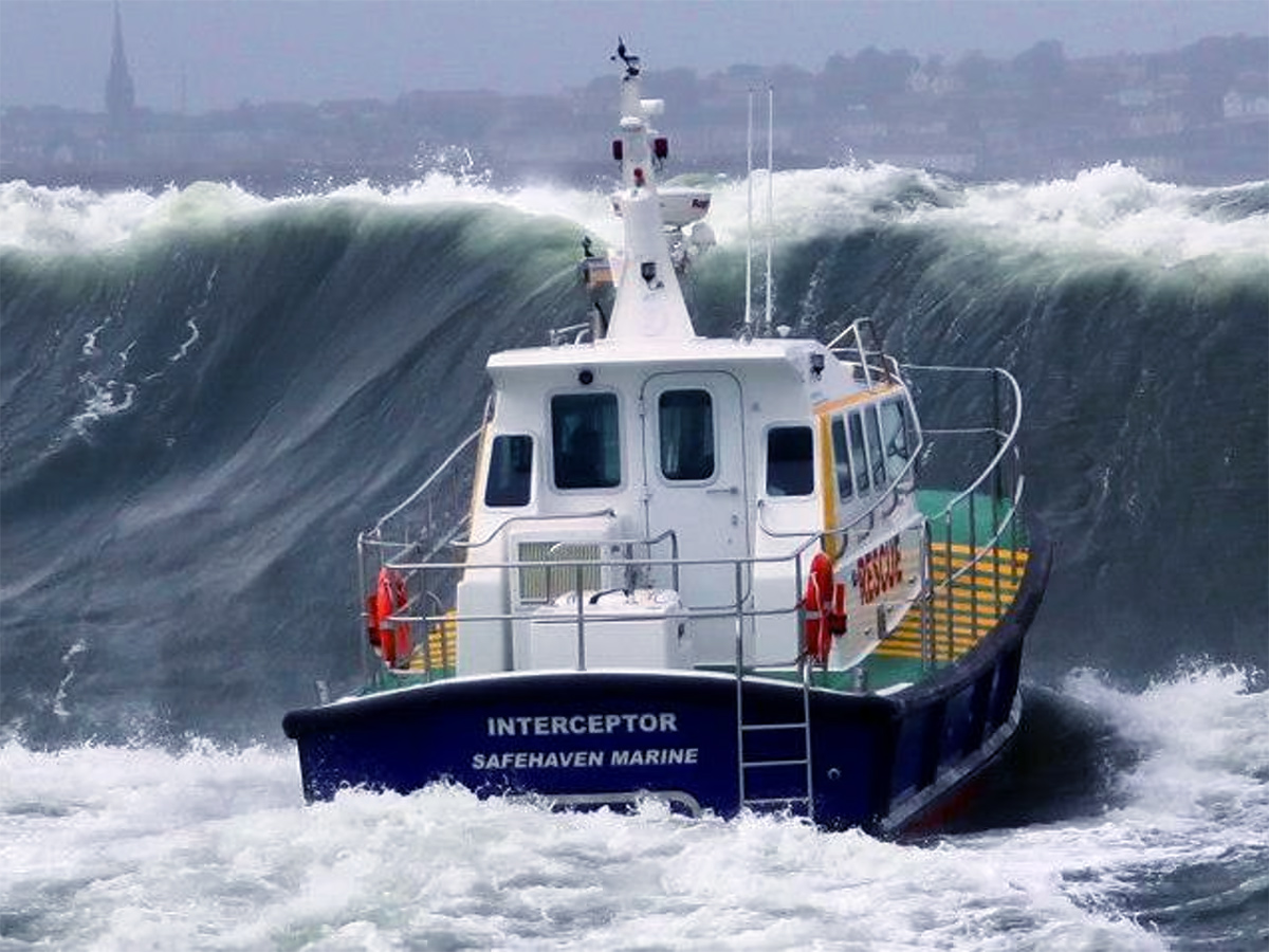 Twin hull hydrofoiling catamaran smashes big wave storm5