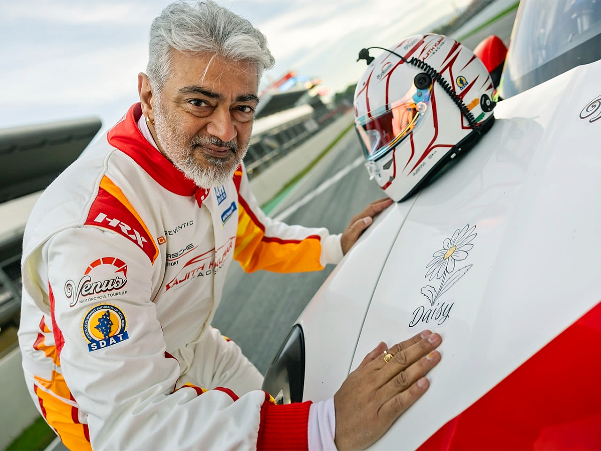 Ajith Kumar Poses with His Race Car At Barcelona F1 Circuit1