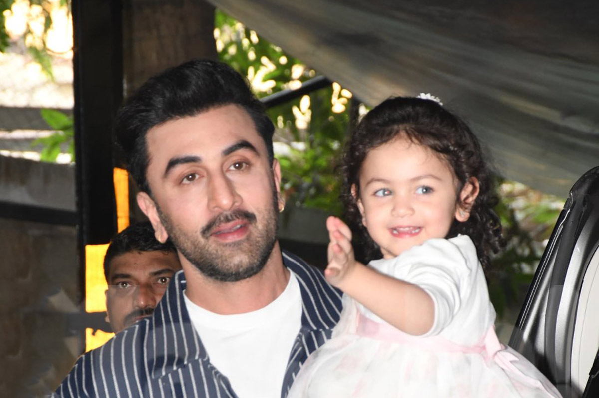 Actor Ranbir Kapoor with his daughter Raha Kapoor poses for pictures12