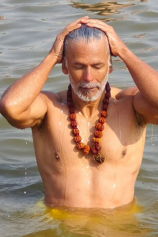 Milind Soman takes holy dip with wife Ankita Konwar at Maha Kumbh Mela Photos14