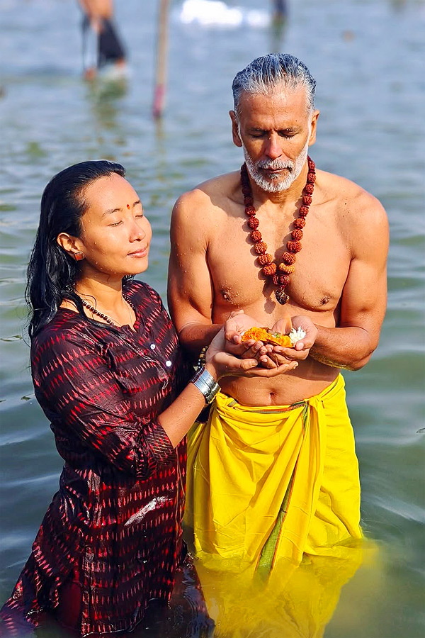 Milind Soman takes holy dip with wife Ankita Konwar at Maha Kumbh Mela Photos16