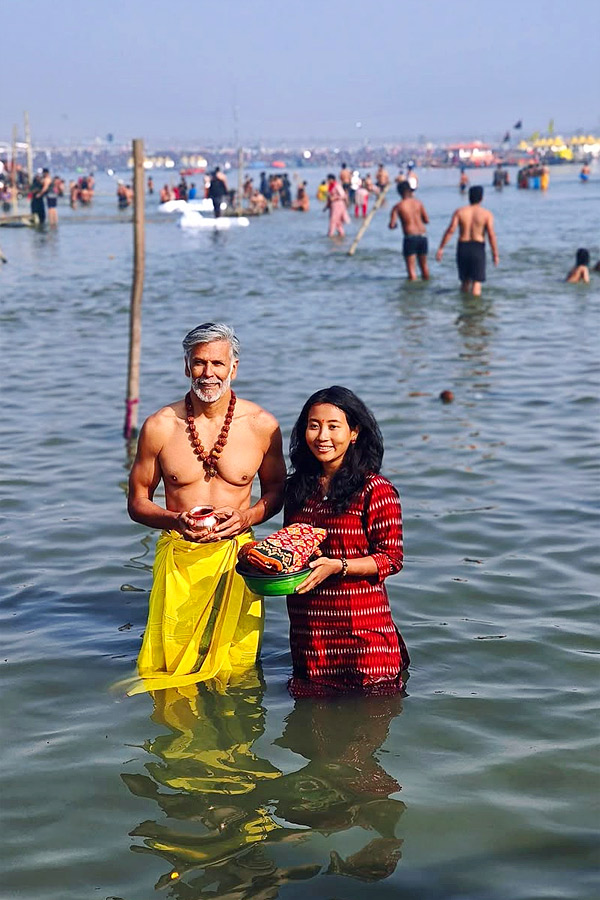 Milind Soman takes holy dip with wife Ankita Konwar at Maha Kumbh Mela Photos17