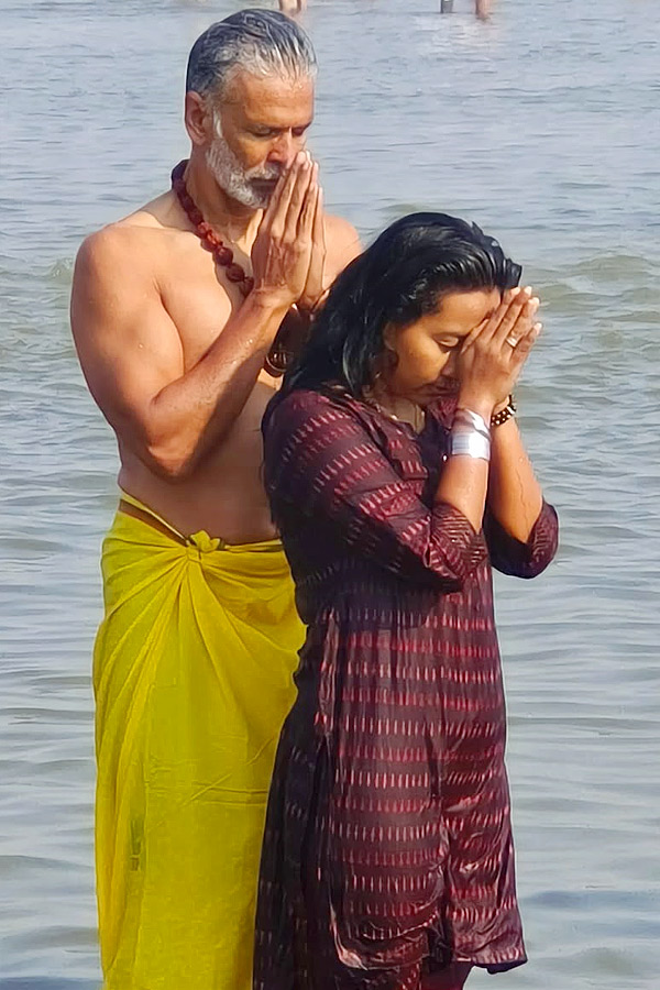 Milind Soman takes holy dip with wife Ankita Konwar at Maha Kumbh Mela Photos19