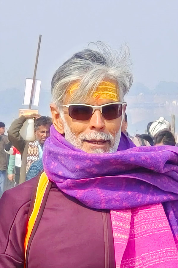 Milind Soman takes holy dip with wife Ankita Konwar at Maha Kumbh Mela Photos5