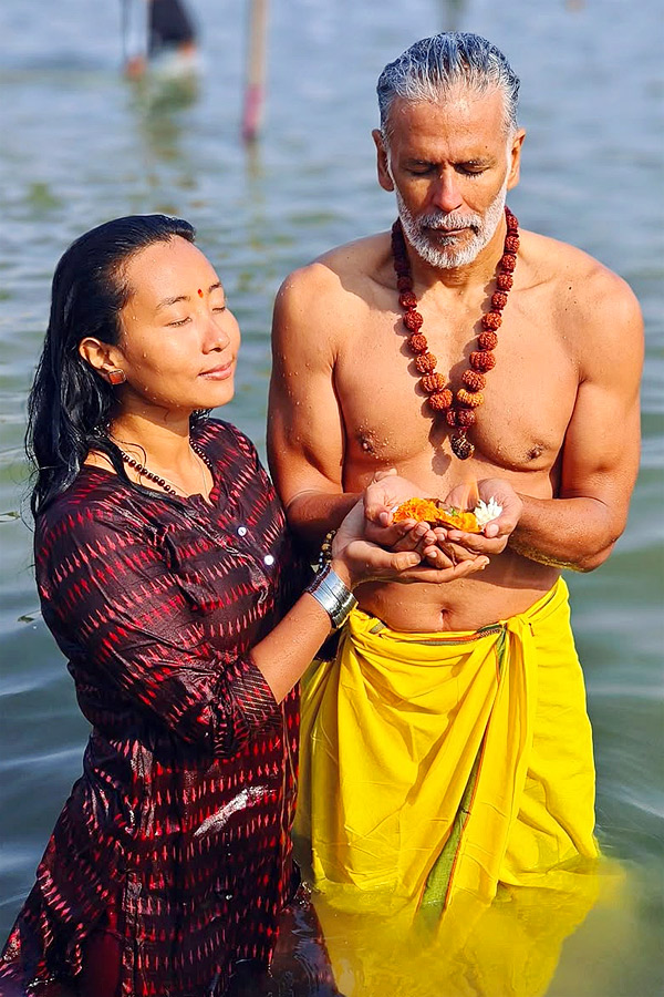 Milind Soman takes holy dip with wife Ankita Konwar at Maha Kumbh Mela Photos7