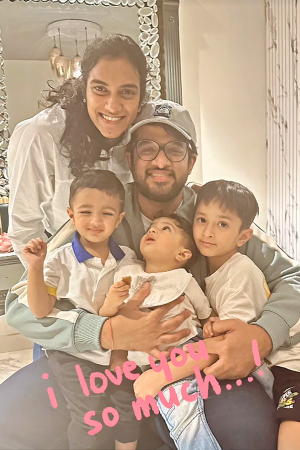 Pv Sindu Shares Cute Picture of kids on her husbands lap Photos2