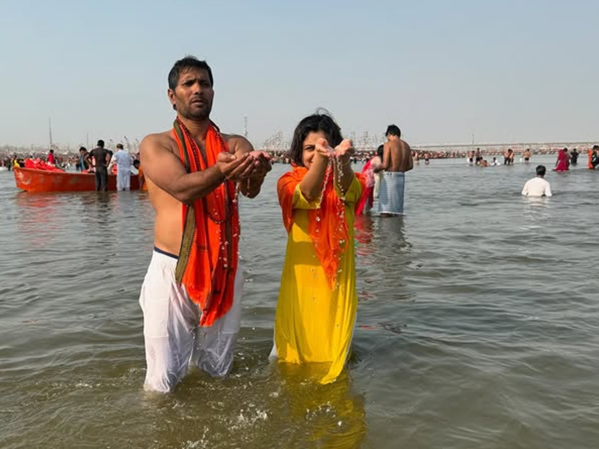 Former Indian bowler Ashok Dinda takes a holy dip in Mahakumbh12