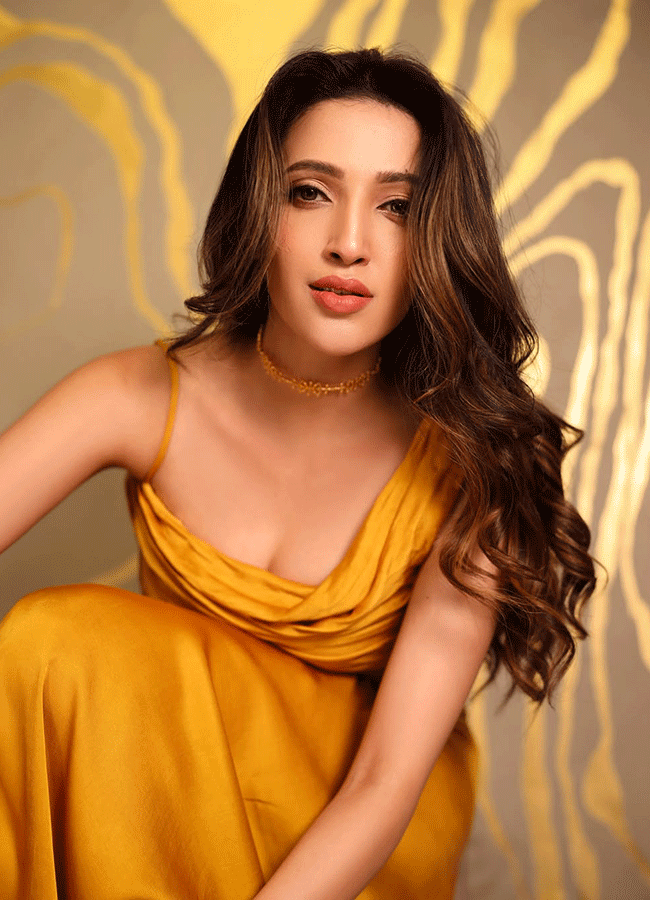 Neha Shetty Stylish Look In Gold Colour Dress3