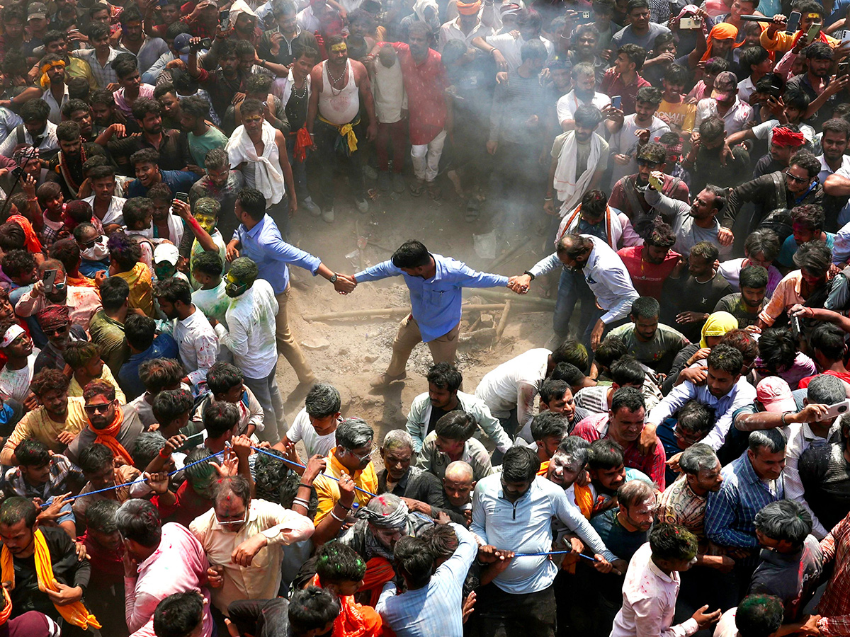 Photos Of Hindu devotees celebrate Holi With Bhasma In Varanasi11