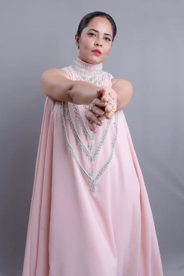 Anasuya Bharadwaj show stopping in soft pink attire 10