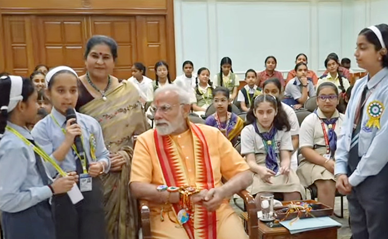 Prime Minister Narendra Modi celebrates Raksha Bandhan with kids Photos10