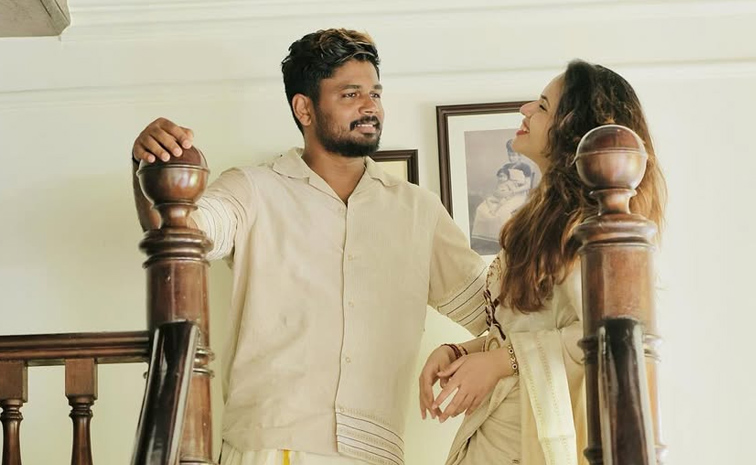 Sanju Samson celebrates Onam with wife Charulatha Photos2
