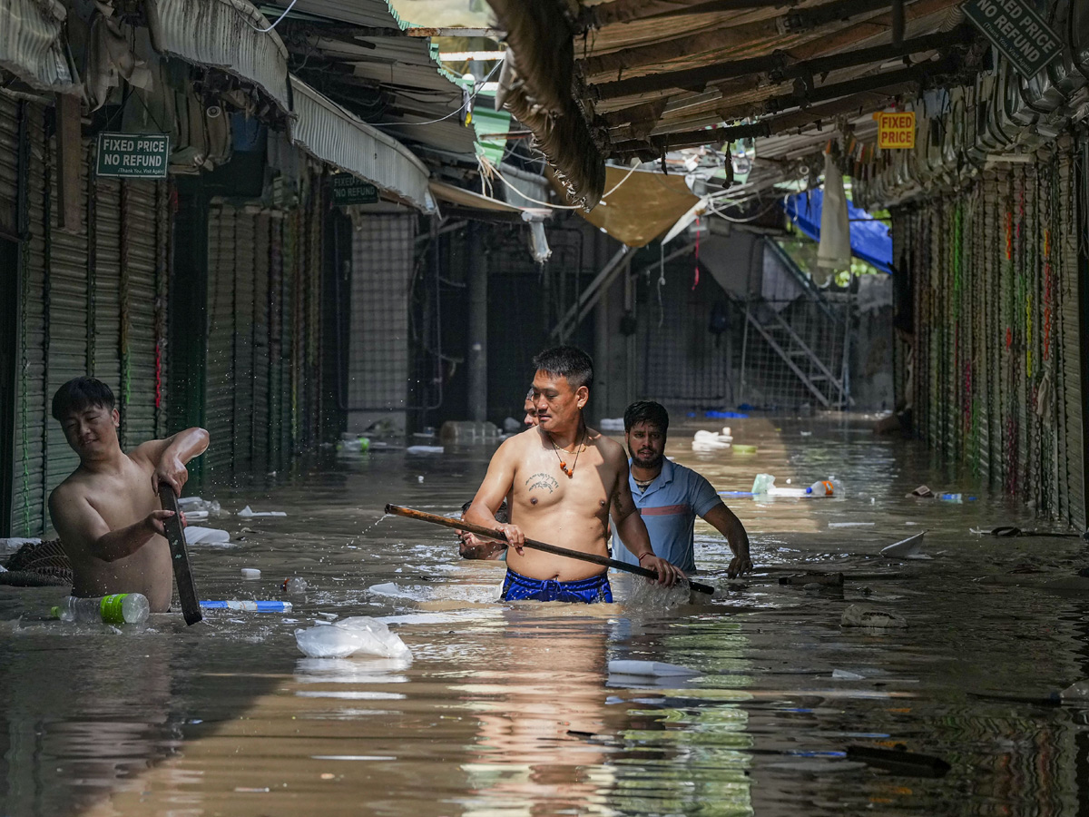 Yamuna Breaches Danger Level Waterlogging in Parts of Delhi Photos - Sakshi