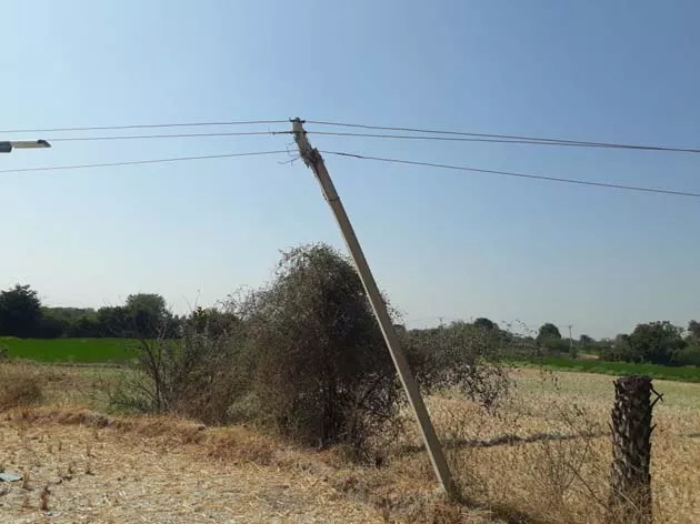 Low hanging wires danger for farmers  - Sakshi