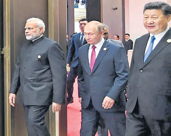 India stays out of move to support China's BRI at SCO meet - Sakshi
