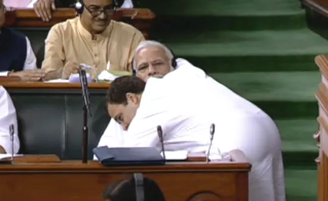 Rahul Gandhi Hugs PM Narendra Modi - Sakshi