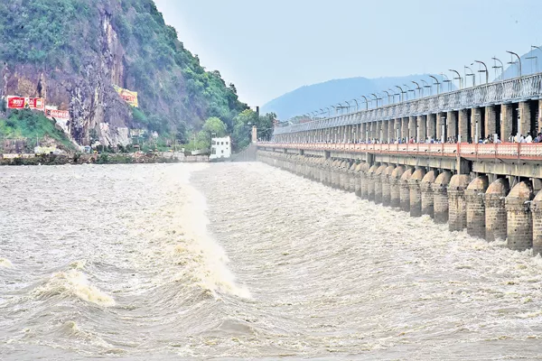 Reduced flooding into the Prakasam barrage - Sakshi
