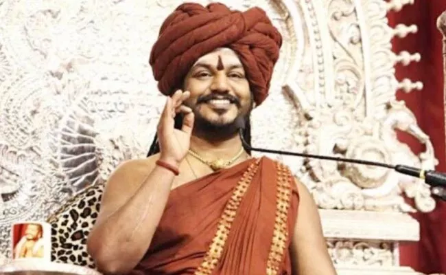 KA Police Says Nithyananda On Spiritual Tour Cannot Serve Notice - Sakshi