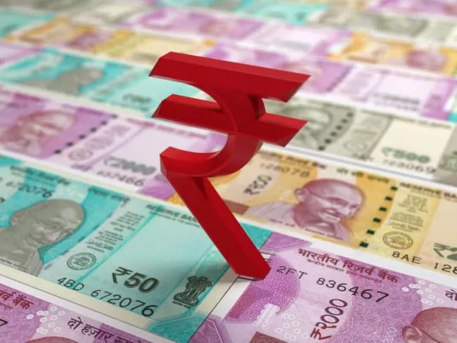Rupee ends lower at 76.03 per dollar - Sakshi