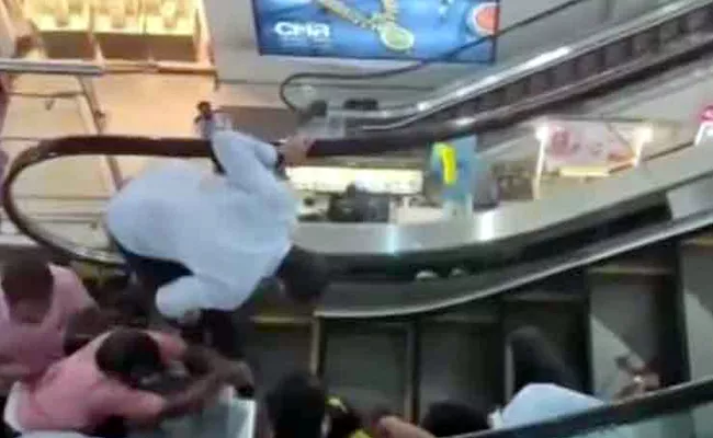Girl Gets Struck In Escalator In Visakhapatnam - Sakshi