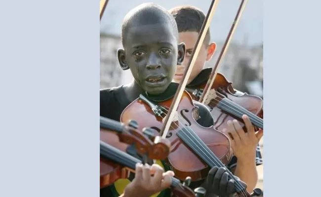 Brazilian Boy Playing Violin At The Funeral Of His Teacher Photo Viral On Social Media - Sakshi