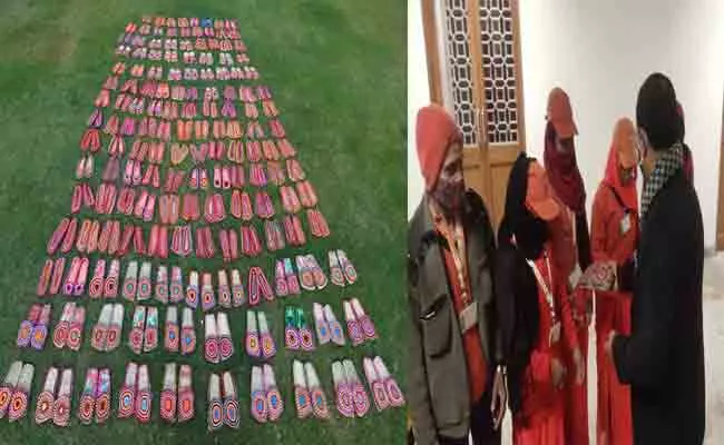 PM Modi Sends 100 Pairs of Jute Footwear To Kashi Vishwanath Dham workers - Sakshi
