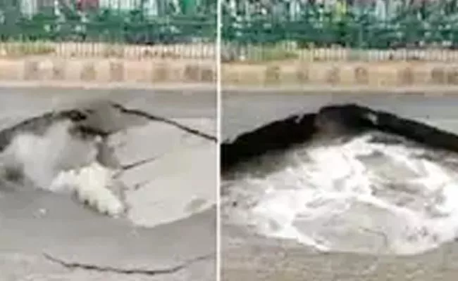 Road Built one month ago in Gujarat caves in after rains - Sakshi